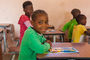 glückliche Kinder in der Schule von Mucuio